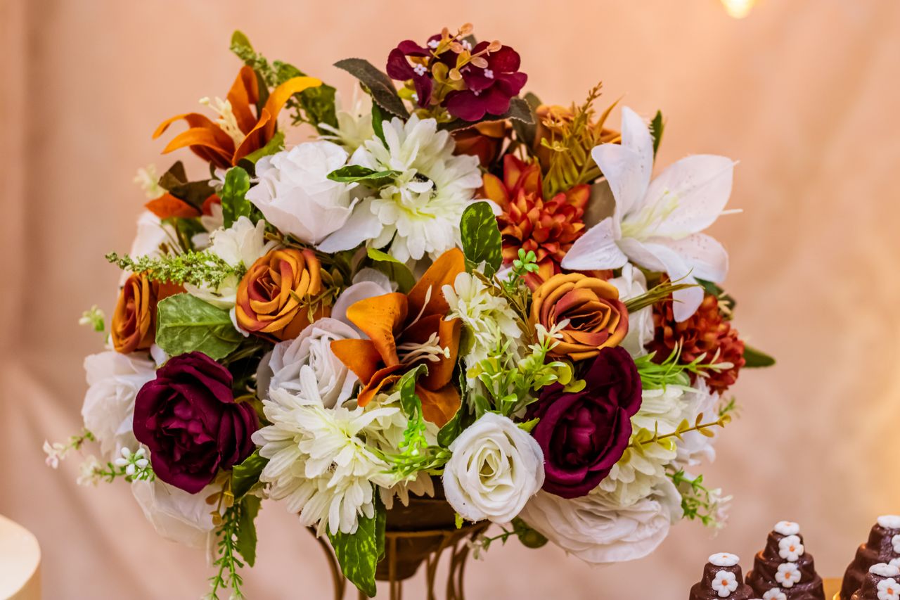 who-we-are Vibrant floral bouquet with mixed flowers including roses and lilies, perfect for weddings.